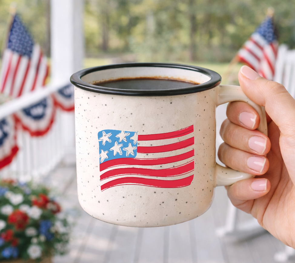 Doodles by Rebekah Americana flag campfire mug featuring a whimsical hand-painted US flag design. This patriotic ceramic coffee cup is ideal for 4th of July celebrations, Memorial Day decor, or as a gift for veterans and farmhouse style lovers.