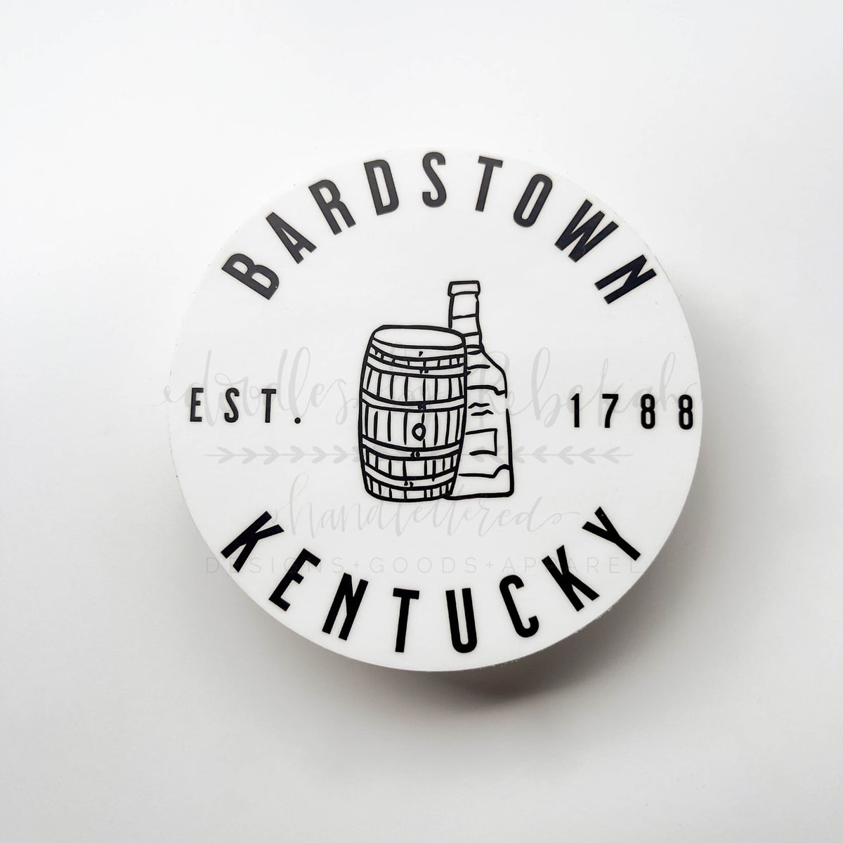 A round white sticker with the text 'BARDSTOWN KENTUCKY EST. 1788' and an illustration of a bourbon barrel.