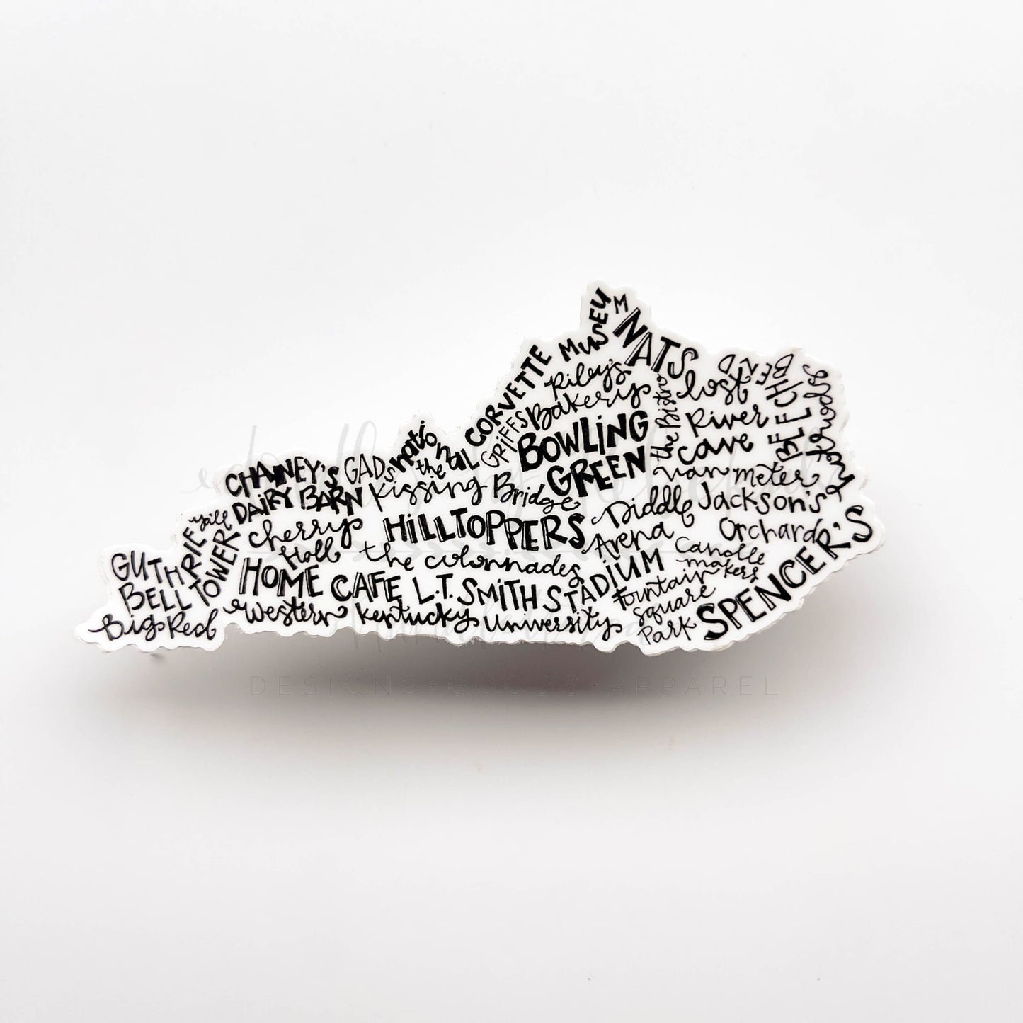 A sticker with word art in the shape of Kentucky, featuring various places and terms related to Bowling Green.