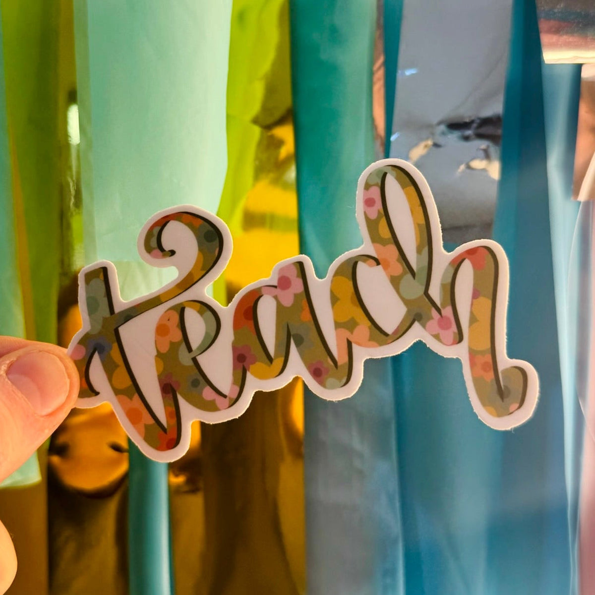 Doodles by Rebekah "teach" floral vinyl sticker. This whimsical hand-painted teacher appreciation decal features a botanical pattern inside elegant script, making it a perfect gift for educators to decorate laptops, water bottles, and classroom planners.