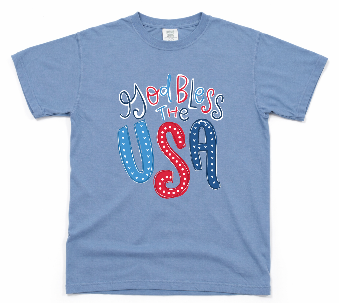 Blue t-shirt with 'God Bless The USA' text in red, white, and blue on a white background