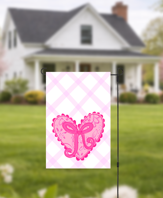 Doodles by Rebekah decorative pink heart garden flag with a whimsical hand-painted design and pink checkered background. This charming outdoor seasonal decor is perfect for Valentine’s Day, spring garden displays, or as a romantic touch to front yard landscaping.