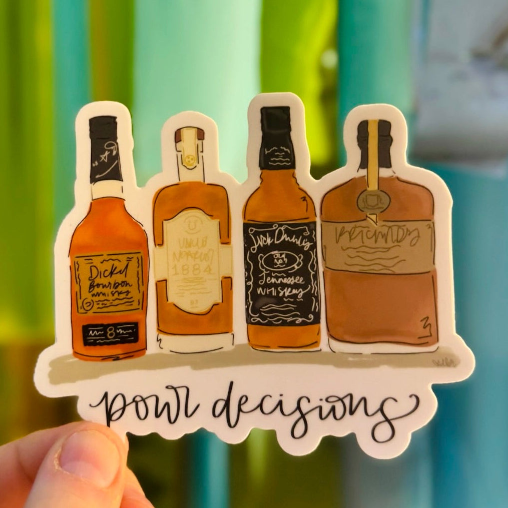Doodles by Rebekah "pour decisions" whiskey and bourbon vinyl sticker. This whimsical hand-painted spirits decal features four different liquor bottles and a humorous pun, making it a perfect gift for whiskey lovers to decorate water bottles, laptops, and home bar carts.