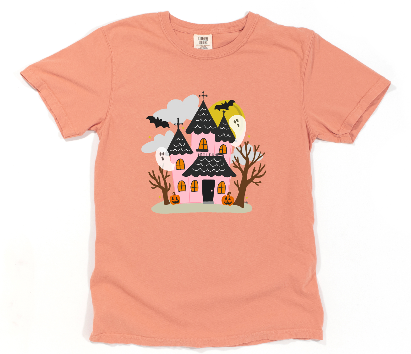 Peach t-shirt with a Halloween-themed graphic of a haunted house on a white background