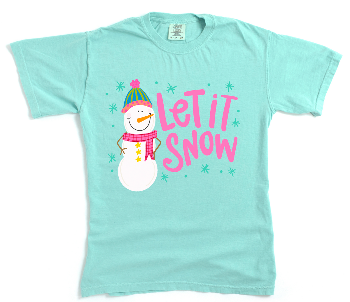 Light blue t-shirt with a snowman graphic and 'Let It Snow' text on a white background