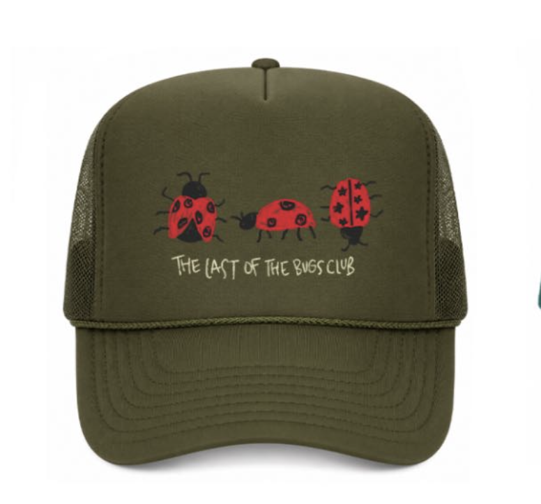 Green cap with ladybug design and text on a white background