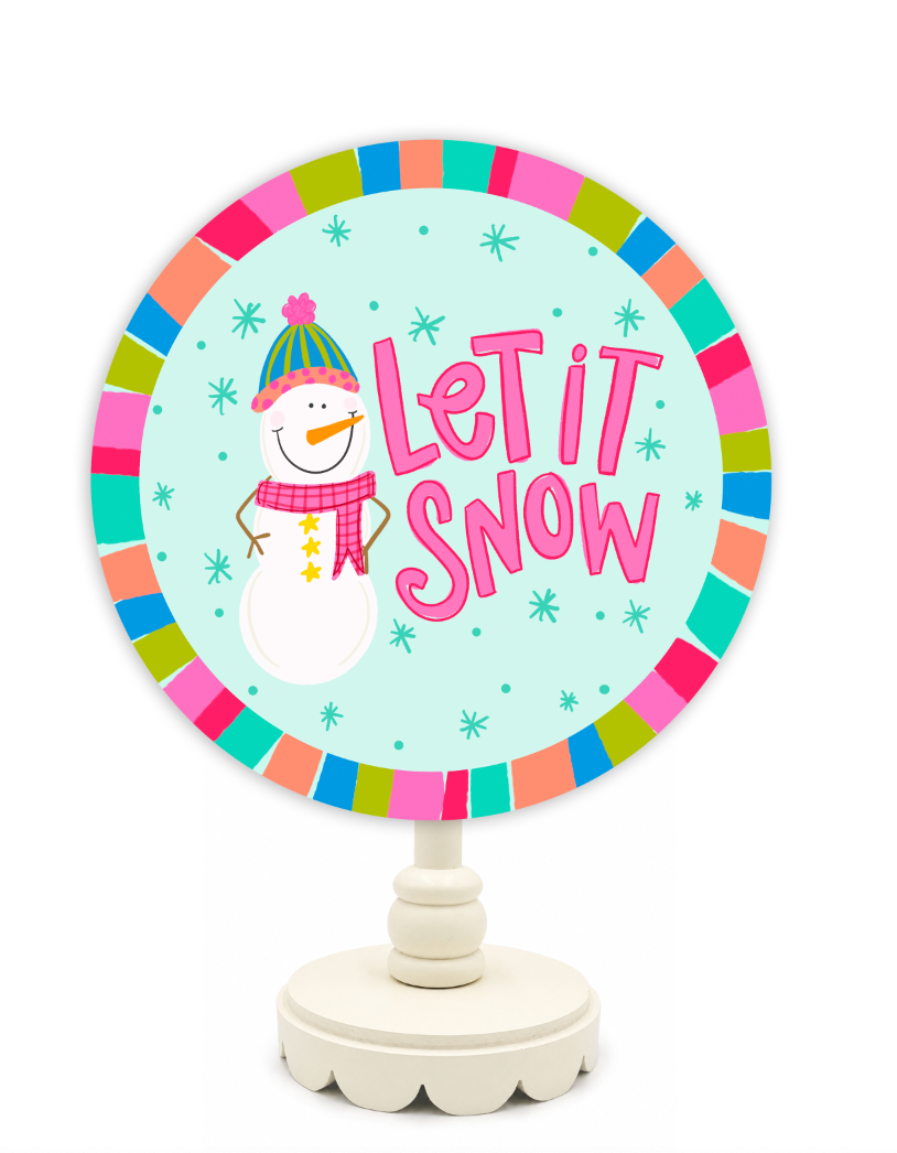 Decorative sign with a snowman and 'Let It Snow' text on a white background