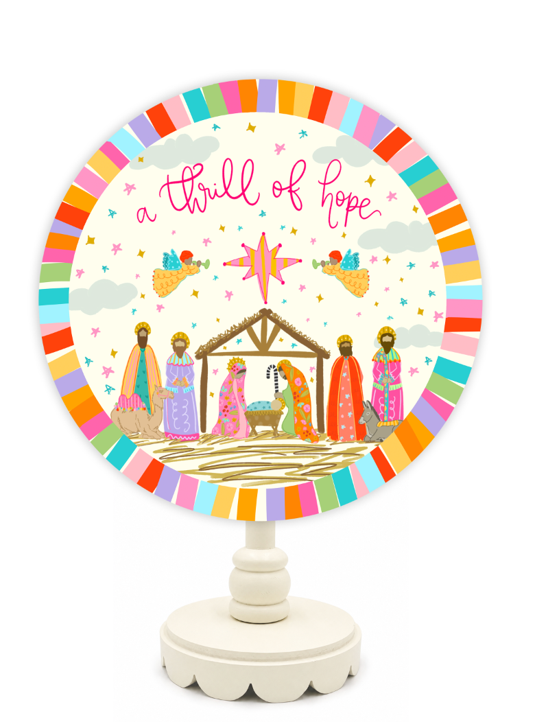 Decorative plate with nativity scene and colorful border on a white background