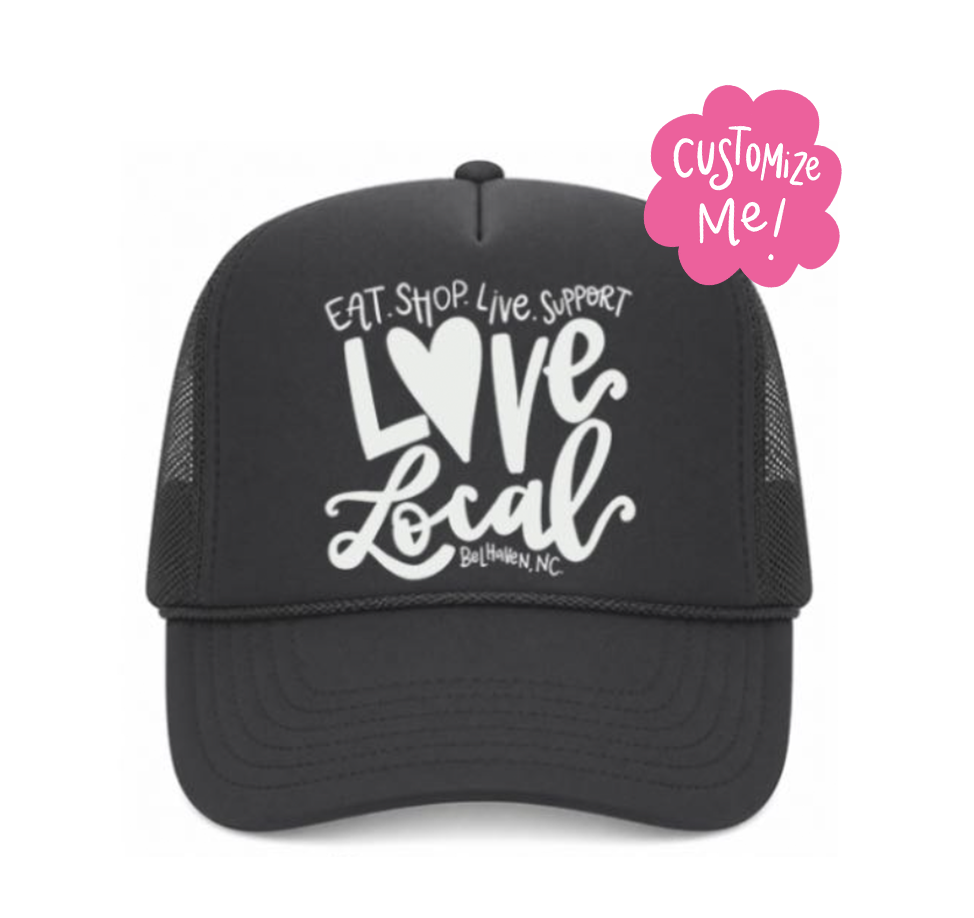 Black trucker cap with 'Love Local' text and a pink customization badge on a white background