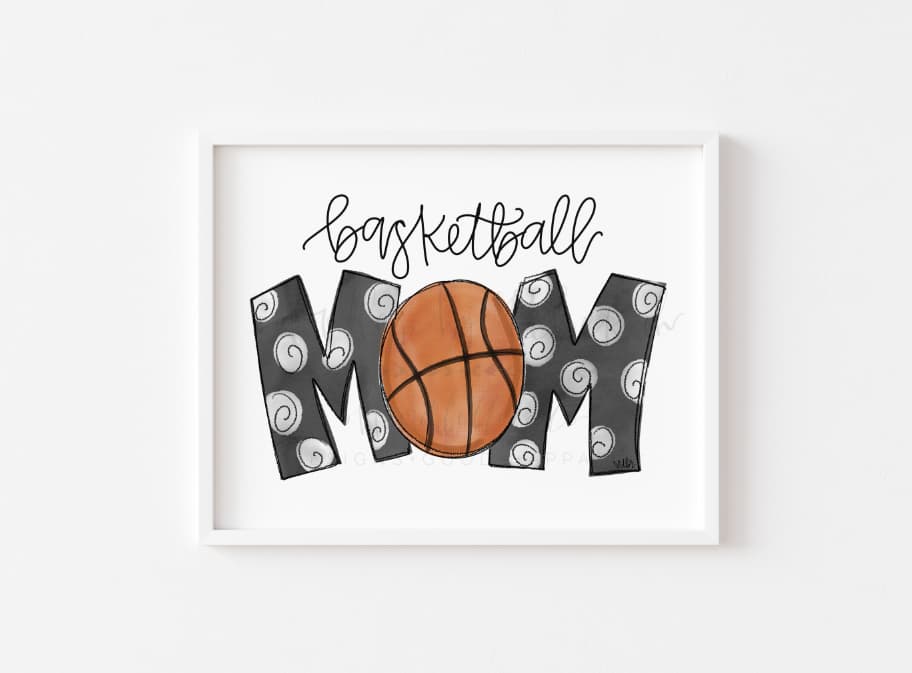 An 8x10 framable print featuring the words 'BASKETBALL MOM' in a whimsical font, surrounded by a graphic of a basketball and swirl designs.