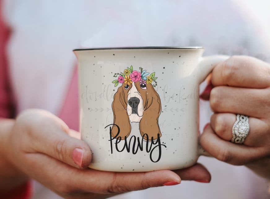 Woman holding a coffee mug with an image of basset hound named Penny