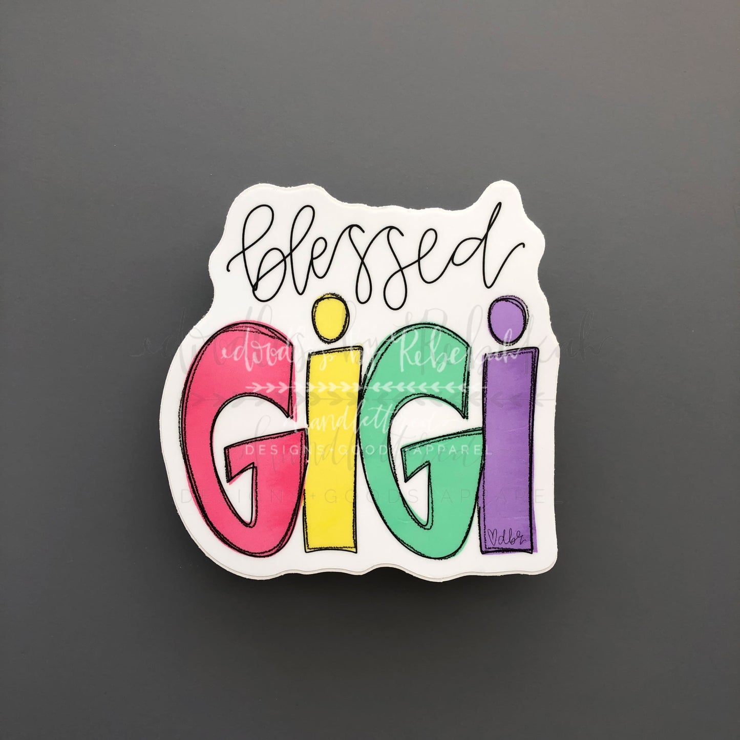 Colorful sticker reading "Blessed Gigi" in Rebekah's handwriting