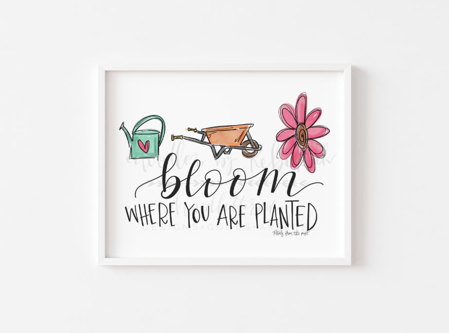 White poster that reads "BLoom Where You Are Planted"