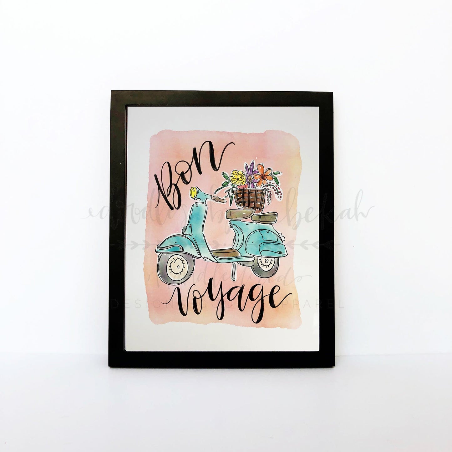 An 8x10 framable print featuring hand-lettered 'Bon Voyage' text in a colorful design, depicting a scooter and a basket with flowers.