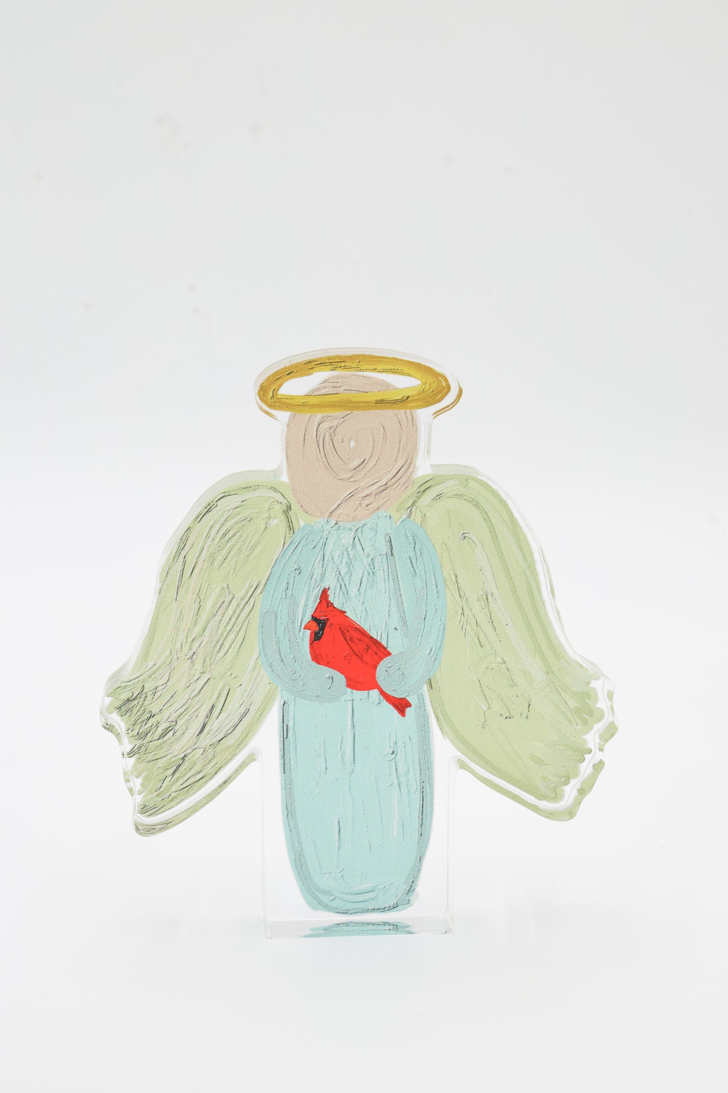 Angel figurine with a red cardinal on a white background