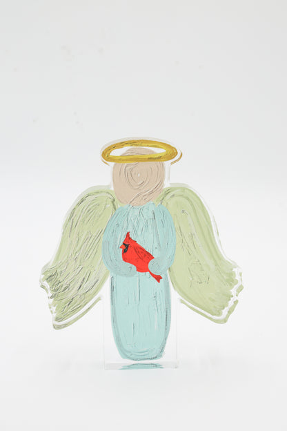 Angel figurine with a red cardinal on a white background