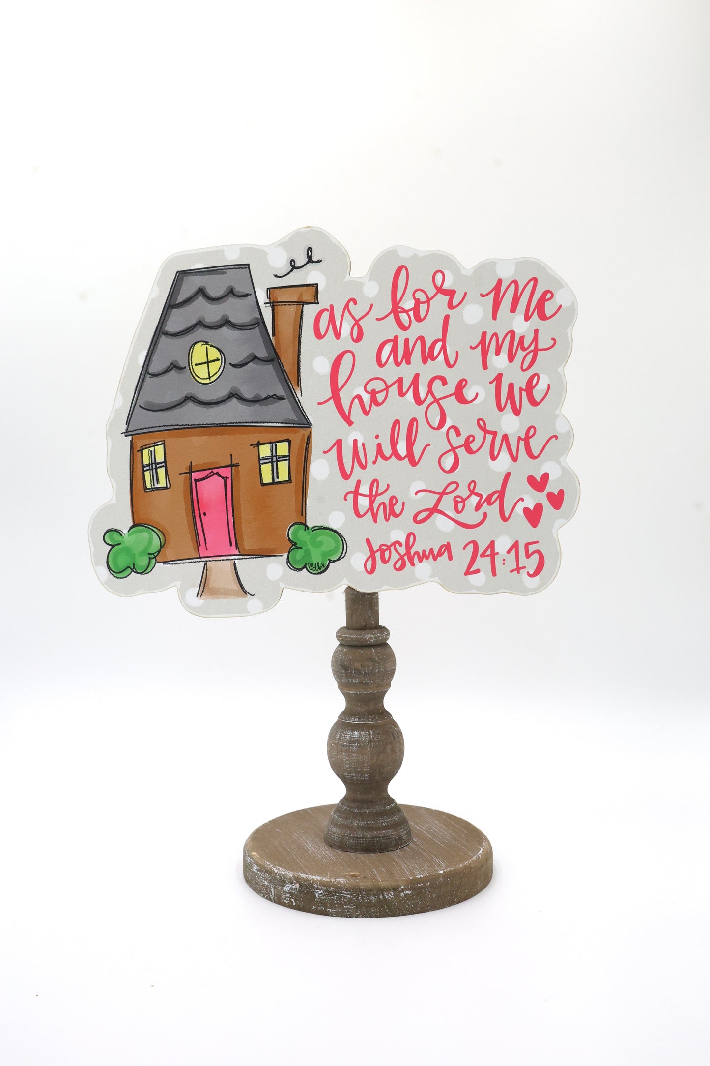 Decorative house-shaped sign with a wooden stand on a white background