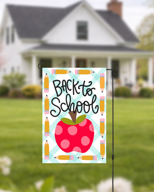 Doodles by Rebekah "Back to School" garden flag featuring a whimsical hand-painted polka dot apple and pencil border. This educational-themed outdoor decor, with its teal checkered background, is perfect for welcoming students, teacher gifts, or seasonal school-year yard displays.