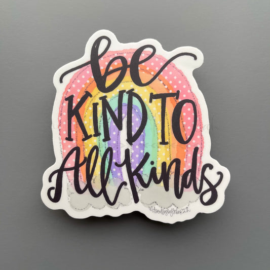 Vinyl sticker with rainbow graphic and phrase "Be kind to all kinds"
