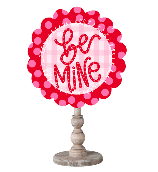 Decorative sign with 'Be Mine' text on a white background