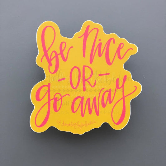 A yellow sticker with the phrase 'be nice - or - go away' in red script.