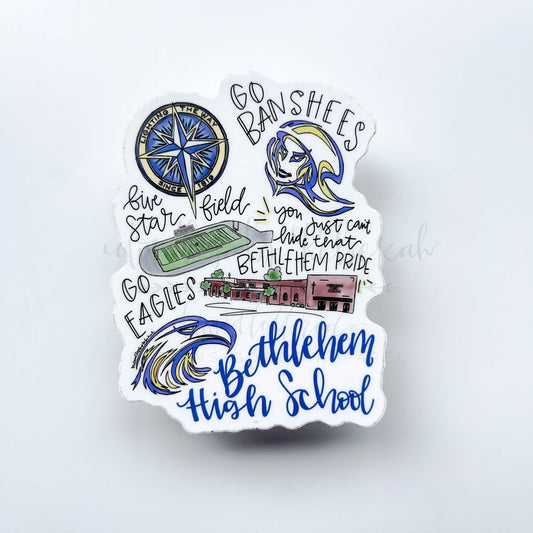 A sticker with a graphic design featuring text and images such as a football field, a baseball bat, and a building, with the text 'Bethlehem Pride High School'.