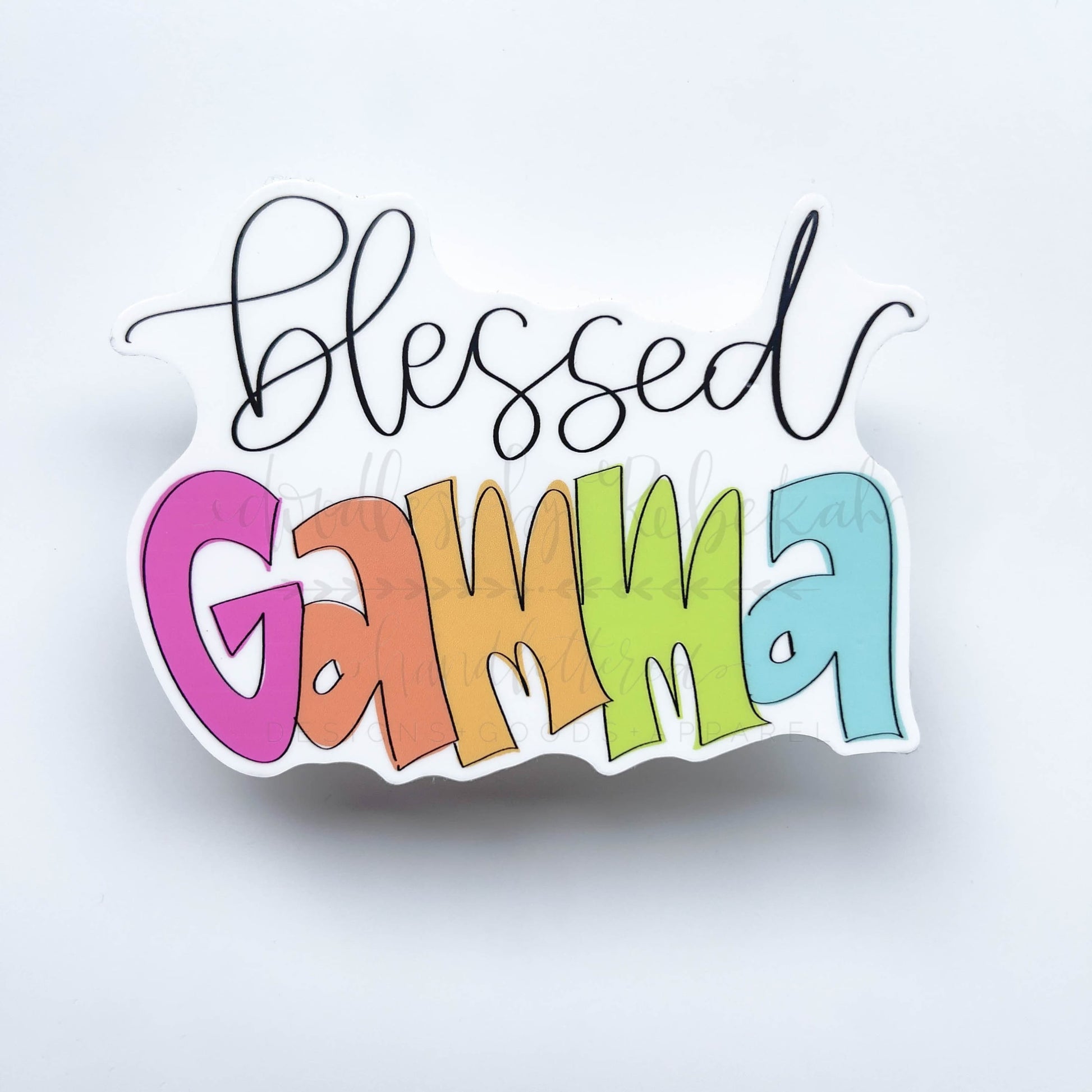A colorful sticker with the text 'Blessed Gamma' in a handwritten style font on a white background.