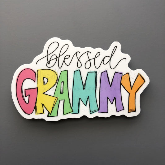 A sticker with the text 'blessed GRAMMY' in colorful, bold lettering on a white outline.