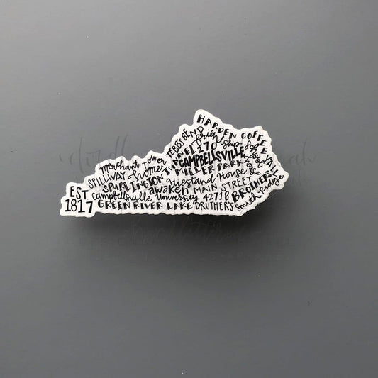 A white word art sticker with black text, shaped like a state, with the text 'CAMPBELLSVILLE KY' and other text related to Campbellsville, KY.