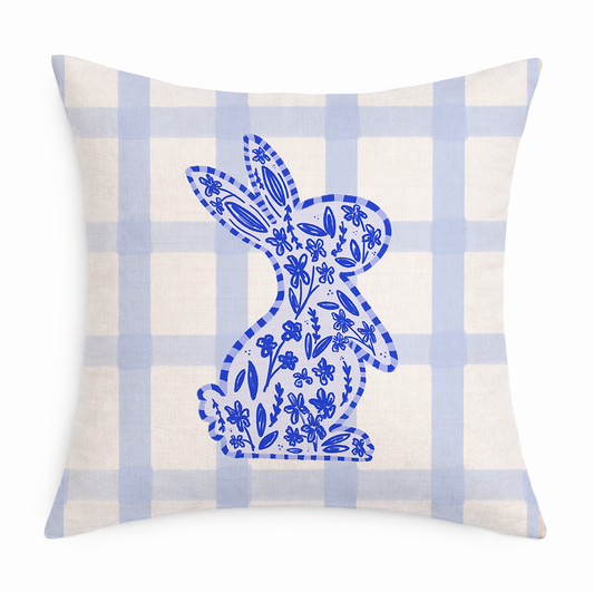 A blue and white gingham pillow with a Chinoiserie Bunny on a white background