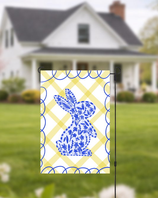 Doodles by Rebekah blue floral bunny garden flag featuring a whimsical hand-painted rabbit silhouette on a yellow checkered background. This charming spring and Easter outdoor decor is perfect for front yards, gardens, or seasonal porch displays.