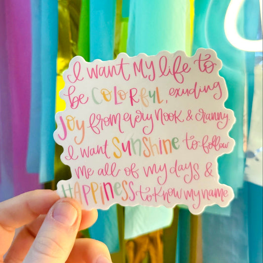 Doodles by Rebekah "I Want My Life to be Colorful" inspirational vinyl sticker. This whimsical hand-painted quote decal features vibrant pink lettering and colorful accent words, making it an uplifting gift for decorating water bottles, laptops, and gratitude journals.