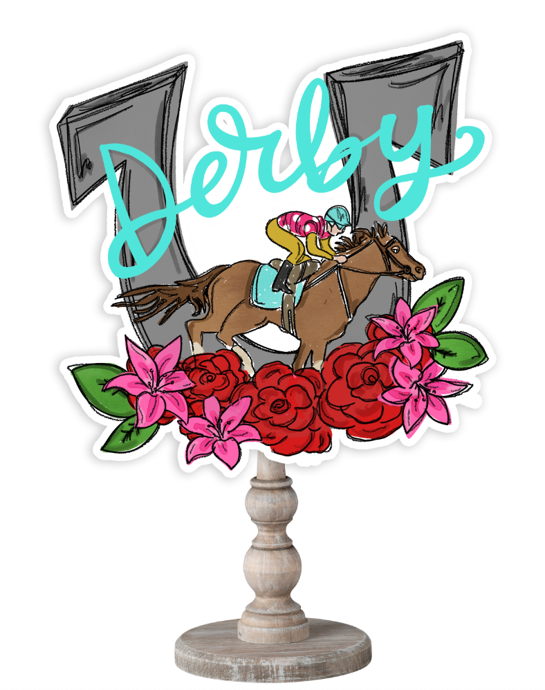 Doodles by Rebekah Kentucky Derby tabletop decor featuring a whimsical horse racing illustration, red roses, pink lilies, and teal "Derby" hand-lettering on a rustic wood stand.