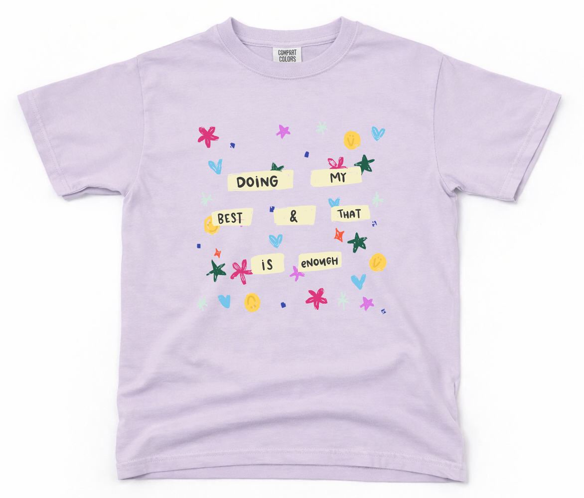 Lavender t-shirt with colorful text and graphics on a white background