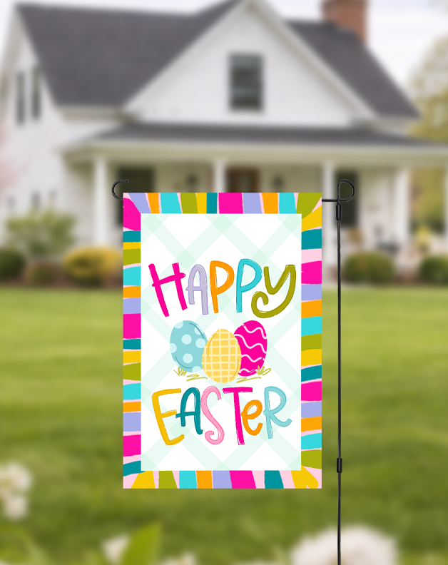 Doodles by Rebekah "Happy Easter" garden flag featuring whimsical hand-painted eggs and a multi-colored striped border. This vibrant spring outdoor decor, with its teal checkered background, is perfect for Easter celebrations, front yard displays, or seasonal garden accents.