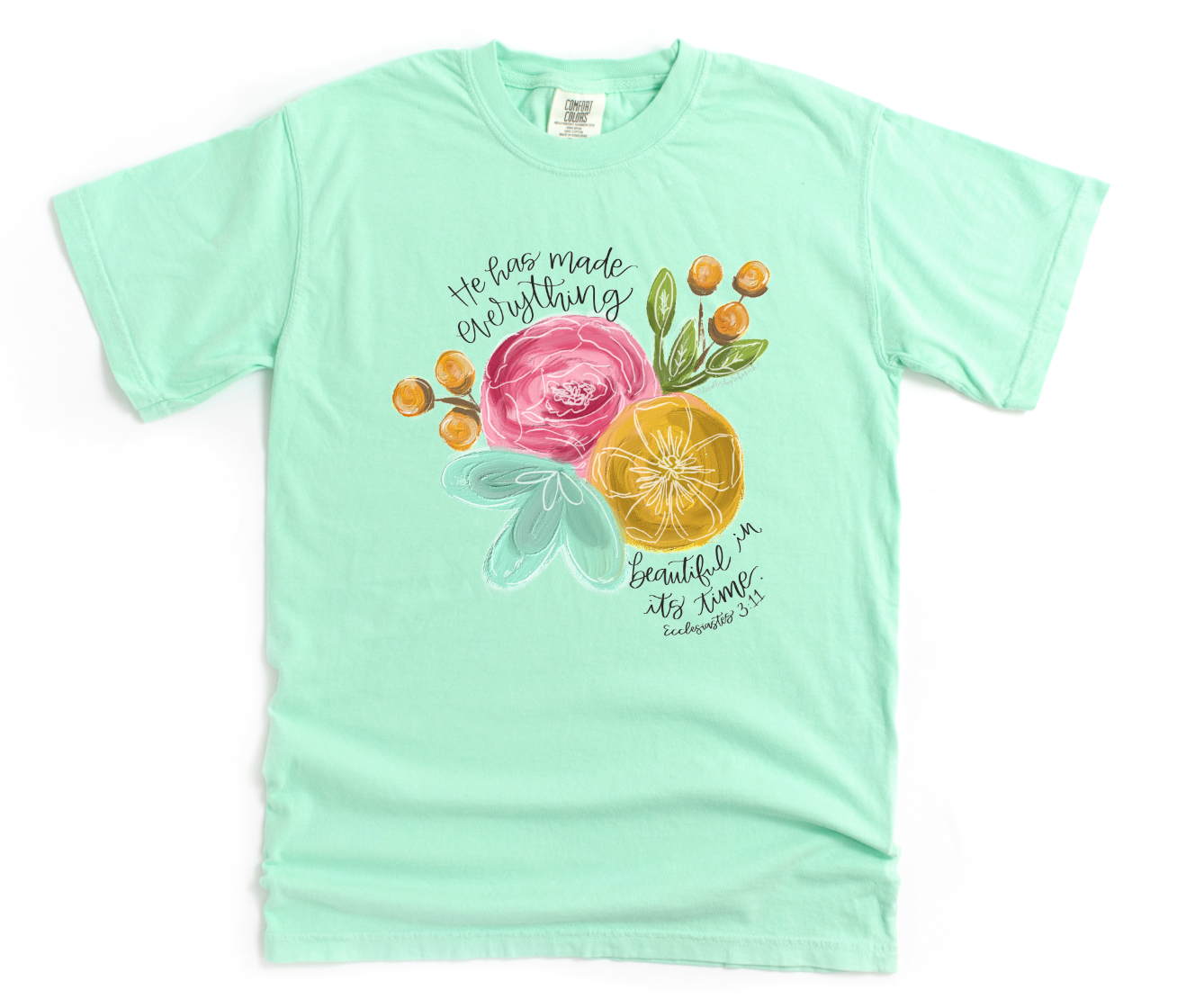 Mint green t-shirt with floral design and text on a white background
