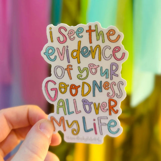 Doodles by Rebekah "I See The Evidence Of Your Goodness" inspirational faith sticker. This colorful hand-painted vinyl decal with whimsical typography is a perfect motivational gift for decorating water bottles, prayer journals, and Bible covers.
