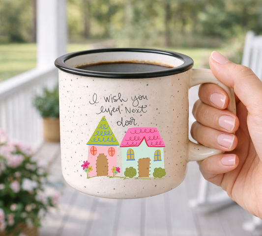 Doodles by Rebekah "I Wish You Lived Next Door" friendship mug. This whimsical hand-painted ceramic coffee cup features charming cottage illustrations and is an ideal gift for long-distance best friends, moving away gifts, or neighbor appreciation.