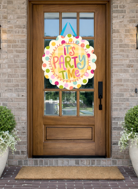 Doodles by Rebekah "It's Party Time" birthday door decor featuring a whimsical hand-drawn design and colorful polka dots on a rustic front porch.