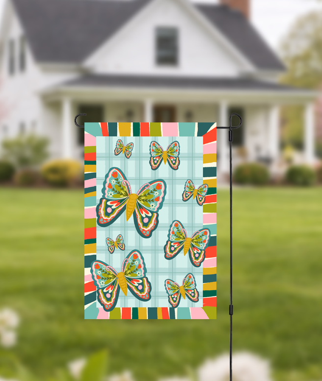 Doodles by Rebekah butterfly garden flag featuring whimsical hand-painted butterflies and a teal checkered pattern. This colorful outdoor spring and summer decor is perfect for front yards, flower gardens, or seasonal porch displays.