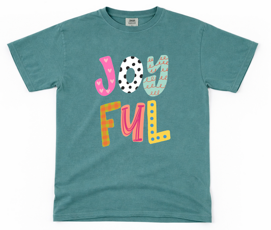 Teal t-shirt with colorful 'JOYFUL' text on a white background