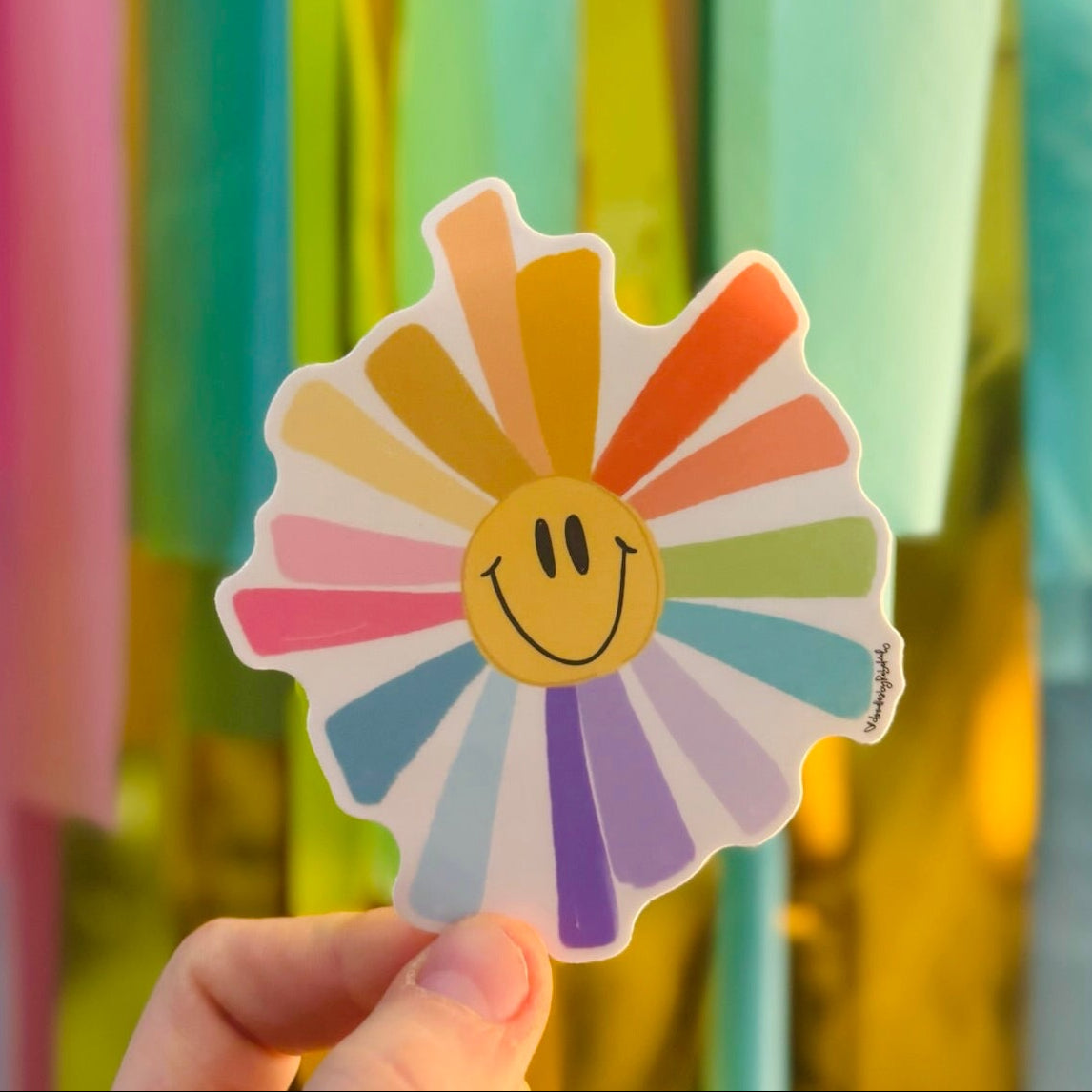Doodles by Rebekah rainbow smiley flower sticker. This whimsical hand-painted vinyl decal is a perfect "happy" gift for decorating water bottles, laptops, and journals to spread positivity and colorful retro vibes.