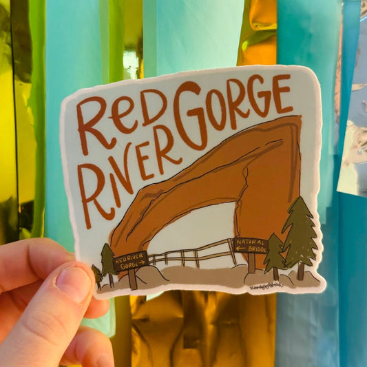 Doodles by Rebekah Red River Gorge Natural Bridge souvenir sticker. This whimsical hand-painted vinyl decal is a perfect travel gift for hikers and nature lovers to decorate water bottles, laptops, and outdoor gear.