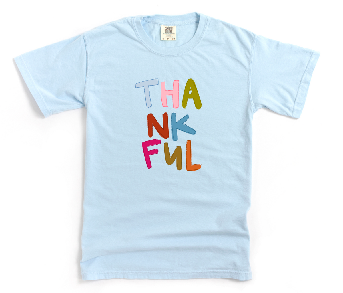 Light blue shirt with 'Thankful' in colorful text on a white background
