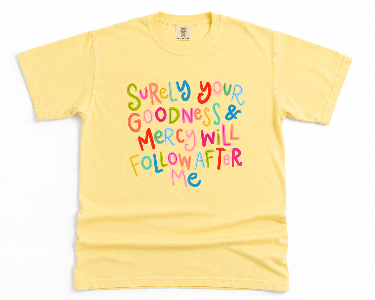 Yellow t-shirt with colorful text on a white background
