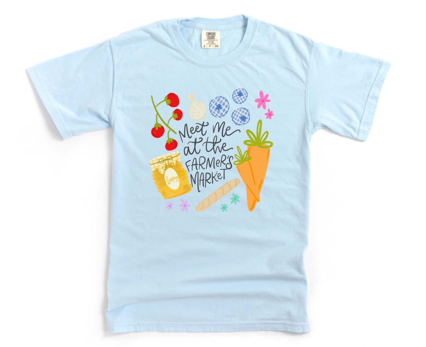 Light blue t-shirt with colorful graphics and 'meet me at the farmer's market' text on a white background