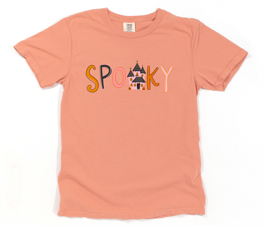 Peach t-shirt with 'Spooky' text and haunted house graphic on a white background