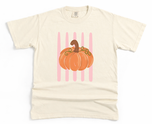 Beige t-shirt with a pumpkin graphic on a white background
