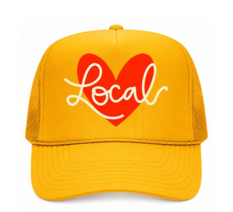 Yellow cap with a red heart and 'Local' text on a white background