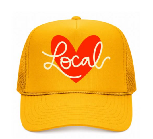 Yellow cap with a red heart and 'Local' text on a white background